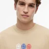 Tommy Jeans マルチクレスト ロゴ Tシャツ