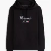 Tommy x Cadillac F1® Team マイアミ フーディー Tommy x Cadillac F1® Team マイアミ フーディー